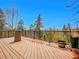 Spacious deck with tree-stump table and stunning mountain and tree views at 30813 Kings Valley Dr, Conifer, CO 80433