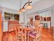 Charming dining area with natural wood floors, connecting to a well-appointed kitchen at 30813 Kings Valley Dr, Conifer, CO 80433