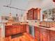 Modern kitchen with wood cabinetry, granite counters, stainless appliances, and natural light at 30813 Kings Valley Dr, Conifer, CO 80433