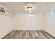 Unfinished basement with plank flooring and recessed lighting, ready to be personalized at 695 S Quitman St, Denver, CO 80219