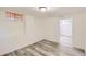 Open basement area featuring durable flooring and neutral paint, ready for customization at 695 S Quitman St, Denver, CO 80219