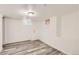 Bright basement with a simple design, featuring plank flooring and neutral tones at 695 S Quitman St, Denver, CO 80219