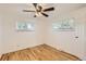 Bright bedroom with hardwood floors and natural light streaming through the windows at 695 S Quitman St, Denver, CO 80219