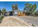 Charming home with modern updates, new paint, a cozy deck, and easy access to a carport at 695 S Quitman St, Denver, CO 80219