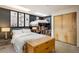 This bedroom features a unique lofted bed and stylish decor, maximizing space and adding personality at 801 Confidence Dr # 2, Longmont, CO 80504