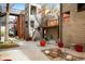 Exterior courtyard of a modern property with landscaping and outdoor seating areas at 801 Confidence Dr # 2, Longmont, CO 80504