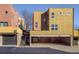 Contemporary building showcasing modern architecture, colorful exteriors and a convenient parking area at 801 Confidence Dr # 2, Longmont, CO 80504
