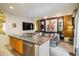 Open kitchen featuring stainless steel appliances, a breakfast bar, and modern lighting at 801 Confidence Dr # 2, Longmont, CO 80504