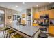 Modern kitchen with stainless steel appliances, bar seating, and an open layout to the bedroom at 801 Confidence Dr # 2, Longmont, CO 80504