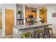 Functional kitchen featuring stainless steel appliances, ample counter space, and breakfast bar seating at 801 Confidence Dr # 2, Longmont, CO 80504