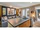Open living space featuring a modern sofa, stylish art, and a glimpse of the outdoor patio at 801 Confidence Dr # 2, Longmont, CO 80504