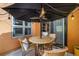 Charming patio under a black umbrella featuring a cozy table and chairs for outdoor dining at 801 Confidence Dr # 2, Longmont, CO 80504