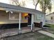 Charming front porch with brick accents, decorative columns, and inviting entrance at 2621 S Federal Blvd, Denver, CO 80219