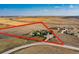 Aerial view outlining property lines of a home and outbuildings on sprawling acreage at 49950 Oak Park Dr, Bennett, CO 80102