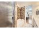 Bathroom featuring tiled tub surround, updated fixtures and vanity. Bedroom view at 49950 Oak Park Dr, Bennett, CO 80102