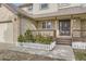 Inviting front porch with wood railings, steps and a decorative white picket fence lining the front of the home at 49950 Oak Park Dr, Bennett, CO 80102