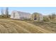 Two greenhouses sit on the property showing opportunities for homegrown produce at 49950 Oak Park Dr, Bennett, CO 80102