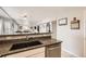 Contemporary kitchen with granite countertops, stainless steel appliances, and a spacious sink for easy meal prep at 49950 Oak Park Dr, Bennett, CO 80102