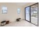 Bright sunroom with sliding glass door leading to deck and views of the property at 49950 Oak Park Dr, Bennett, CO 80102