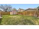 Spacious backyard with a well-maintained lawn and storage shed at 6367 Xavier St, Arvada, CO 80003