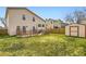Expansive backyard featuring a wooden deck, shed, and lush green grass for outdoor enjoyment at 6367 Xavier St, Arvada, CO 80003