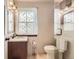 Bathroom featuring a vanity with a dark wood cabinet and white countertop, and a glass shower at 6367 Xavier St, Arvada, CO 80003