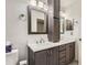 Clean bathroom with a double vanity, bright lighting, and modern finishes at 6367 Xavier St, Arvada, CO 80003
