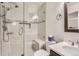 Clean bathroom with a glass-enclosed shower, modern fixtures, and great tile work at 6367 Xavier St, Arvada, CO 80003