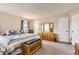 Sunny bedroom with a quilt bed, lots of storage and lots of natural light at 6367 Xavier St, Arvada, CO 80003