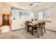 Elegant dining area featuring a modern light fixture, stylish decor, and comfortable seating for four at 6367 Xavier St, Arvada, CO 80003