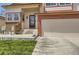 Charming home exterior with a two-car garage, and landscaped front yard at 6367 Xavier St, Arvada, CO 80003