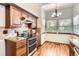 Functional kitchen featuring tile backsplash, stainless steel oven, and convenient breakfast nook at 6367 Xavier St, Arvada, CO 80003