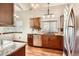 Beautiful kitchen with granite countertops, stainless steel appliances, and ample cabinet space at 6367 Xavier St, Arvada, CO 80003