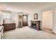 Bright living room featuring a stone fireplace, natural light and carpet at 6367 Xavier St, Arvada, CO 80003