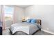Relaxing bedroom with neutral paint, carpet, and a window with pink curtains at 2366 Central Park Blvd, Denver, CO 80238