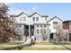 Beautiful townhome featuring inviting entry, charming curb appeal, and low-maintenance landscaping at 2366 Central Park Blvd, Denver, CO 80238