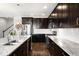 Gourmet kitchen with granite countertops, stainless steel appliances, and ample dark wood cabinetry at 2366 Central Park Blvd, Denver, CO 80238