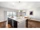 Open living space with a spacious kitchen island and adjacent dining area at 2366 Central Park Blvd, Denver, CO 80238