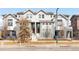 Charming townhome with a well-manicured lawn and inviting curb appeal at 2366 Central Park Blvd, Denver, CO 80238