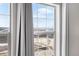Scenic neighborhood view from a large window with sheer curtains at 2366 Central Park Blvd, Denver, CO 80238