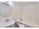 Bathroom with white fixtures, shower, sink and toilet at 62 Newark St # D, Aurora, CO 80012