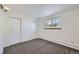 Bedroom with a closet and window with wall to wall carpeting at 62 Newark St # D, Aurora, CO 80012