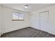 Bedroom with sliding door closet, window and wall to wall carpeting at 62 Newark St # D, Aurora, CO 80012