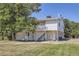 White siding covers this two-story home with a balcony and grassy lawn at 62 Newark St # D, Aurora, CO 80012