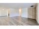 A spacious living room boasts modern flooring and a brick accent wall at 62 Newark St # D, Aurora, CO 80012