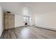 Spacious living room featuring modern floors, light walls, and large windows at 62 Newark St # D, Aurora, CO 80012