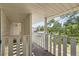 Outdoor patio with white railings and a view of the surrounding greenery at 62 Newark St # D, Aurora, CO 80012