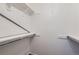 Walk-in closet with white shelving at 62 Newark St # D, Aurora, CO 80012