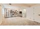 Fully carpeted finished basement with shelving units at 4028 Ames St, Wheat Ridge, CO 80212
