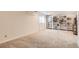 Spacious carpeted basement with built-in bookshelves at 4028 Ames St, Wheat Ridge, CO 80212